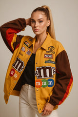 Women's yellow racing jacket with M&M's and Toyota patches – sporty streetwear style